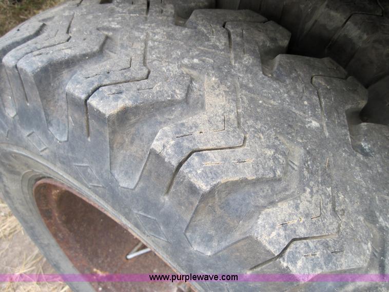 image for item 3180 1989 GMC C7000 flatbed truck with hydraulic post driver