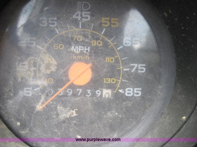 image for item 3180 1989 GMC C7000 flatbed truck with hydraulic post driver