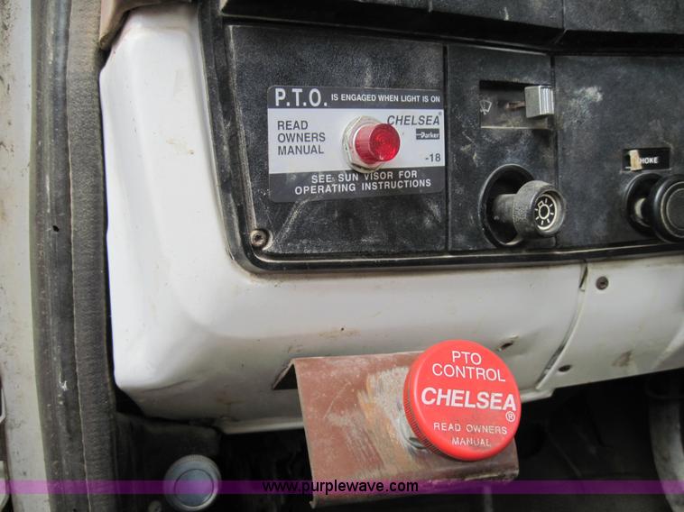 image for item 3180 1989 GMC C7000 flatbed truck with hydraulic post driver