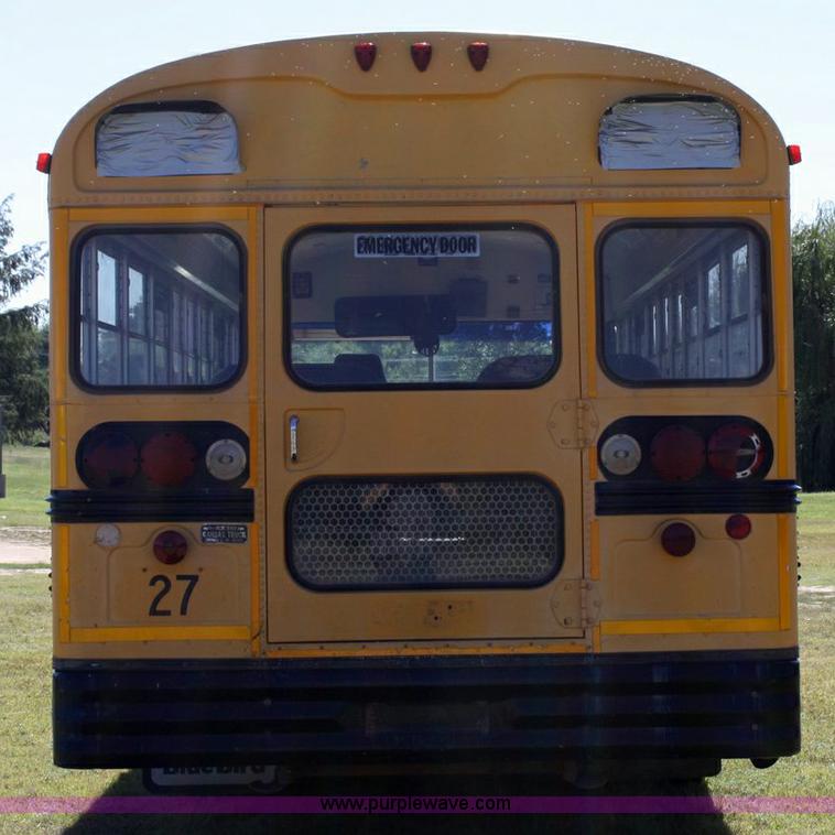 image for item 6329 1997 Ford B800 Blue Bird 59 passenger bus