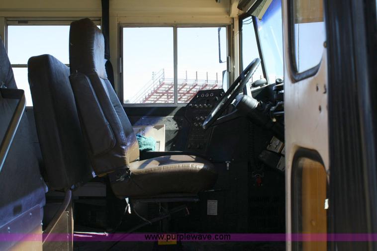 image for item 6329 1997 Ford B800 Blue Bird 59 passenger bus