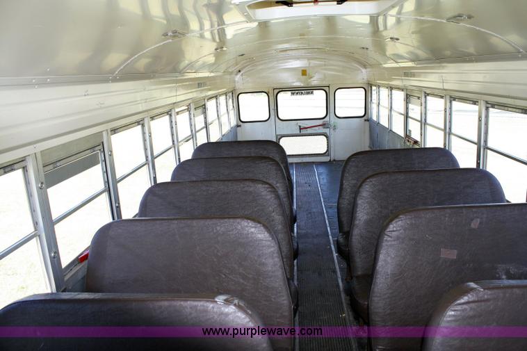 image for item 6329 1997 Ford B800 Blue Bird 59 passenger bus