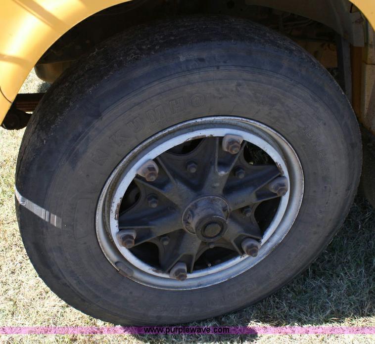 image for item 6329 1997 Ford B800 Blue Bird 59 passenger bus