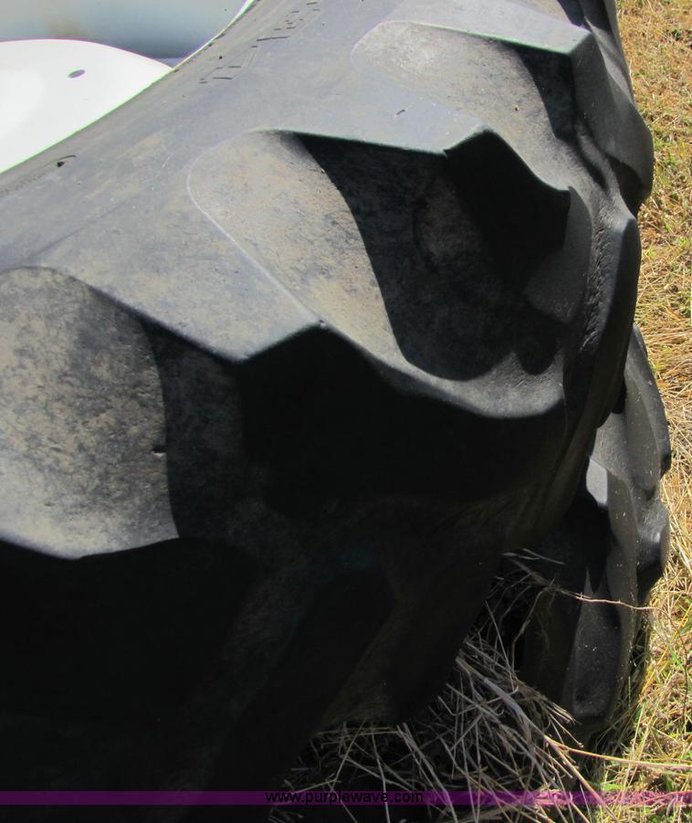 image for item 5171 18.4-34 tires on eight bolt wheels