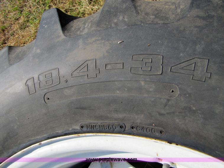 image for item 5171 18.4-34 tires on eight bolt wheels