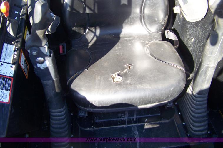 image for item 7377 2004 John Deere 240II skid steer