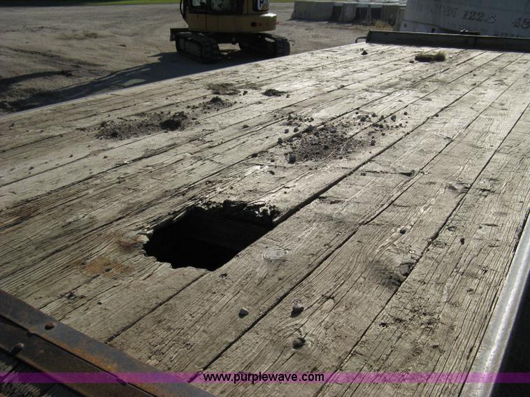 image for item 8041 1997 Circle D 25BHFB dual tandem axle flatbed trailer