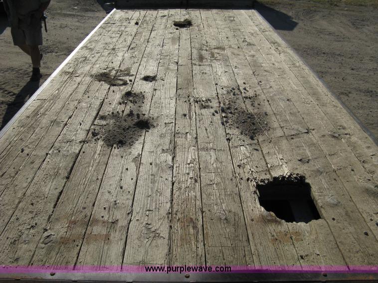 image for item 8041 1997 Circle D 25BHFB dual tandem axle flatbed trailer