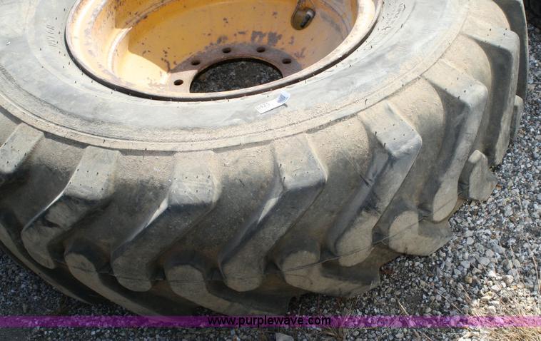 image for item 6425 Firestone 14.00-24 tire and rim