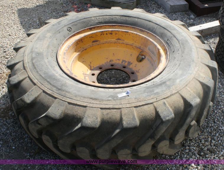 image for item 6425 Firestone 14.00-24 tire and rim