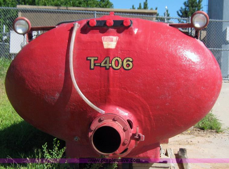 image for item 9001 1985 Palmer Manufacturing 1600 gal. red fiberglass skid water tank