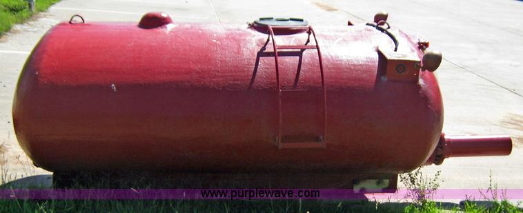 image for item 9001 1985 Palmer Manufacturing 1600 gal. red fiberglass skid water tank
