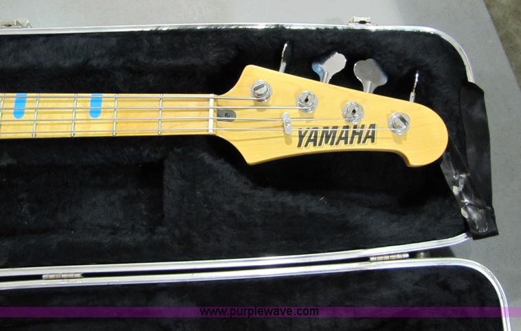image for item 5331 Yamaha bass guitar with case and leather sling