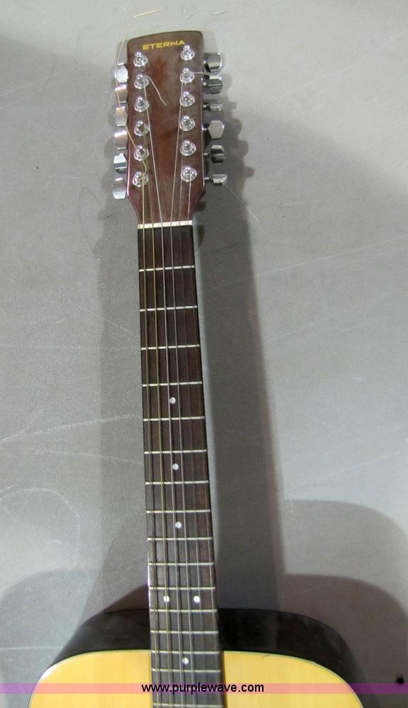 image for item 5332 Eterna acoustic guitar with case and leather sling