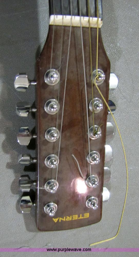 image for item 5332 Eterna acoustic guitar with case and leather sling