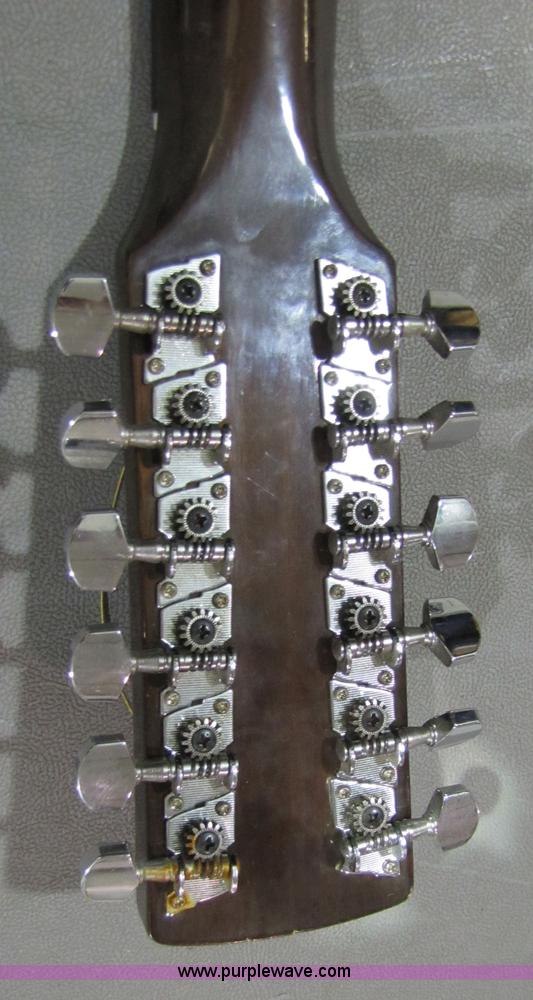 image for item 5332 Eterna acoustic guitar with case and leather sling