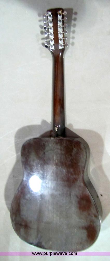 image for item 5332 Eterna acoustic guitar with case and leather sling