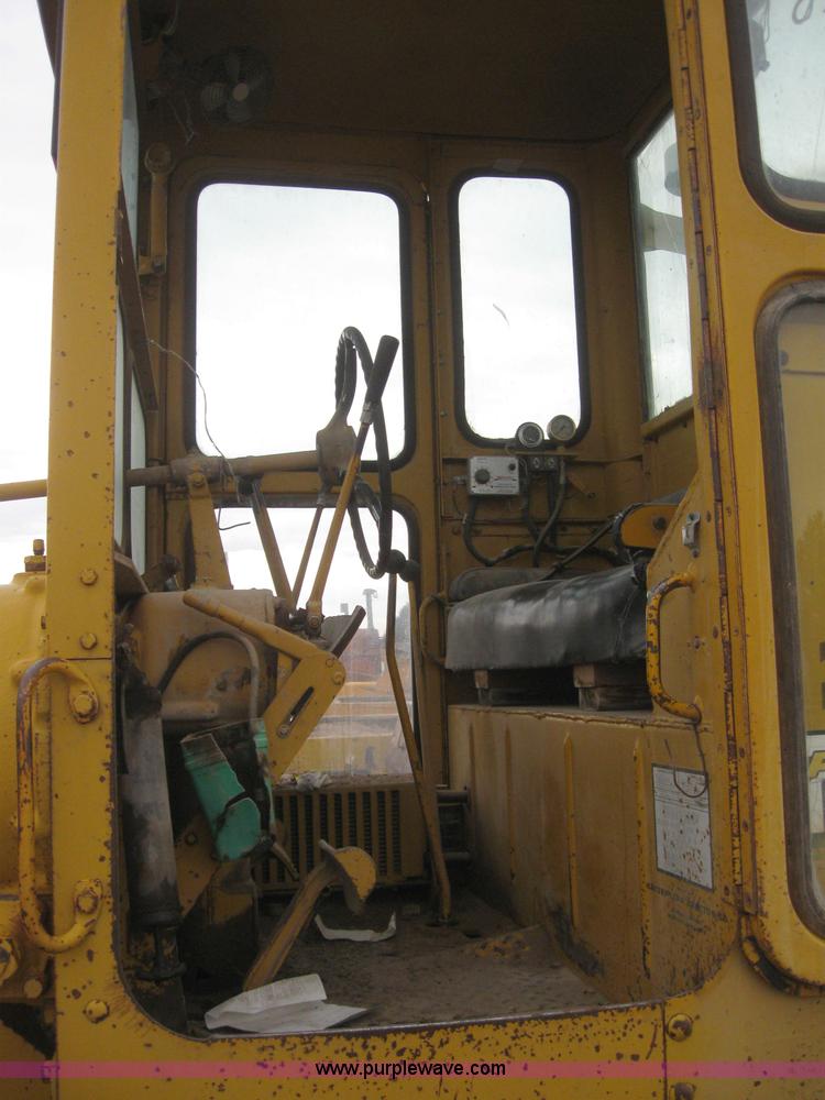 image for item 3083 1967 Caterpillar 120 motor grader with boomer elevator