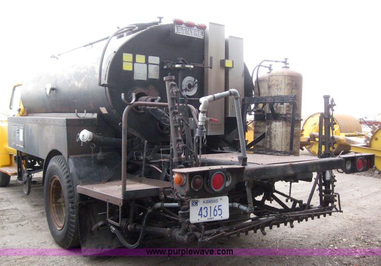 image for item 3093 1973 Ford F700 black topper truck