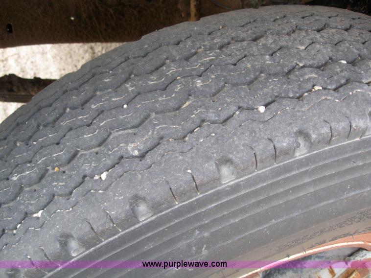 image for item 3093 1973 Ford F700 black topper truck