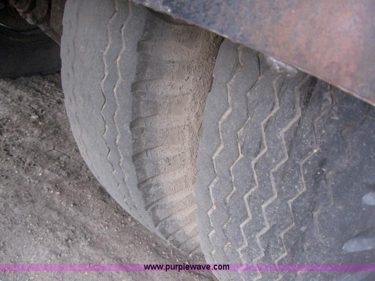 image for item 3093 1973 Ford F700 black topper truck