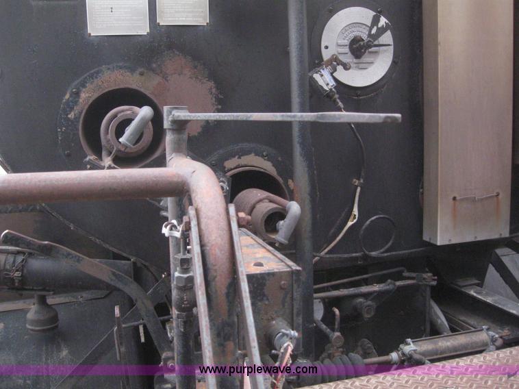 image for item 3093 1973 Ford F700 black topper truck