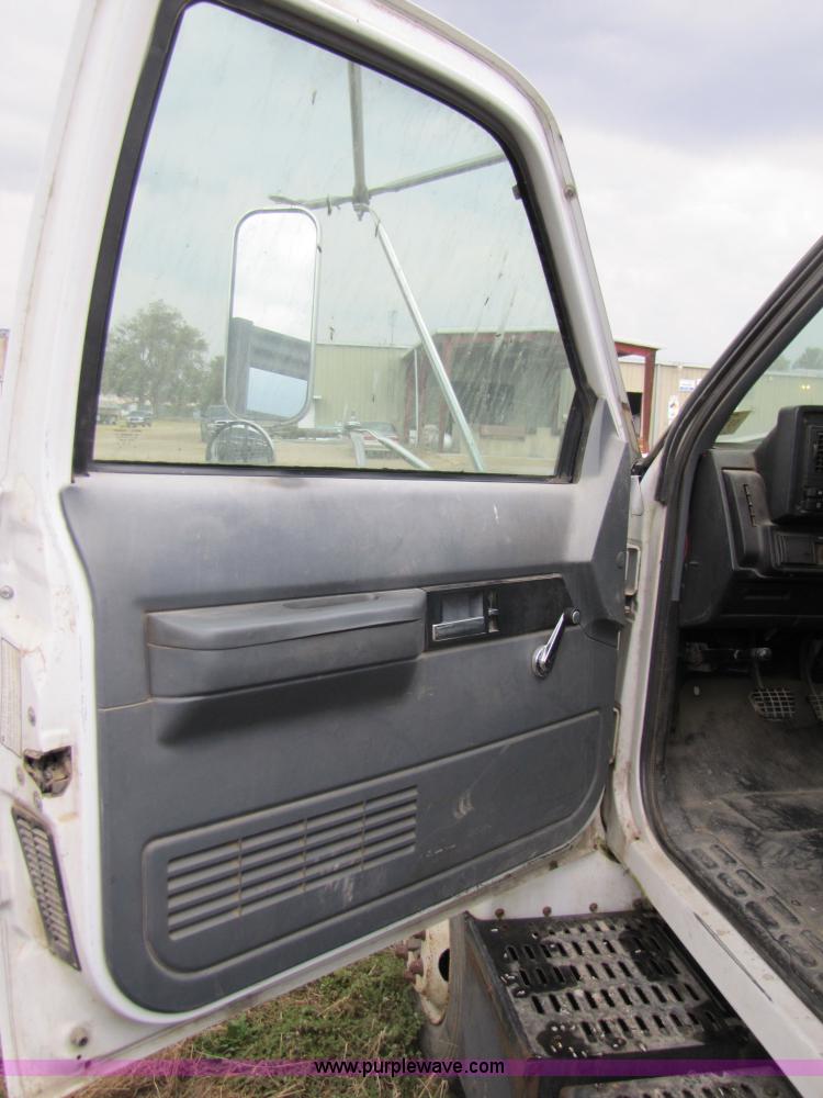 image for item 3468 1994 GMC 6000 Topkick truck with 14' flatbed