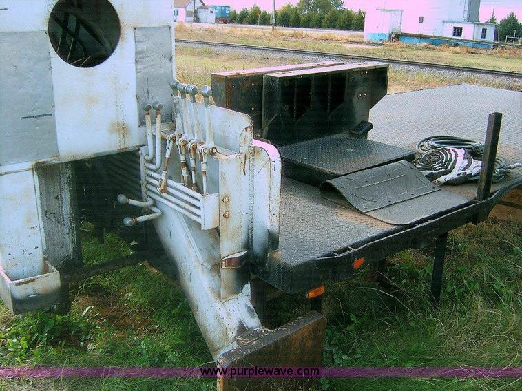 image for item 1863 RO TC120-4E boom hoist with bed