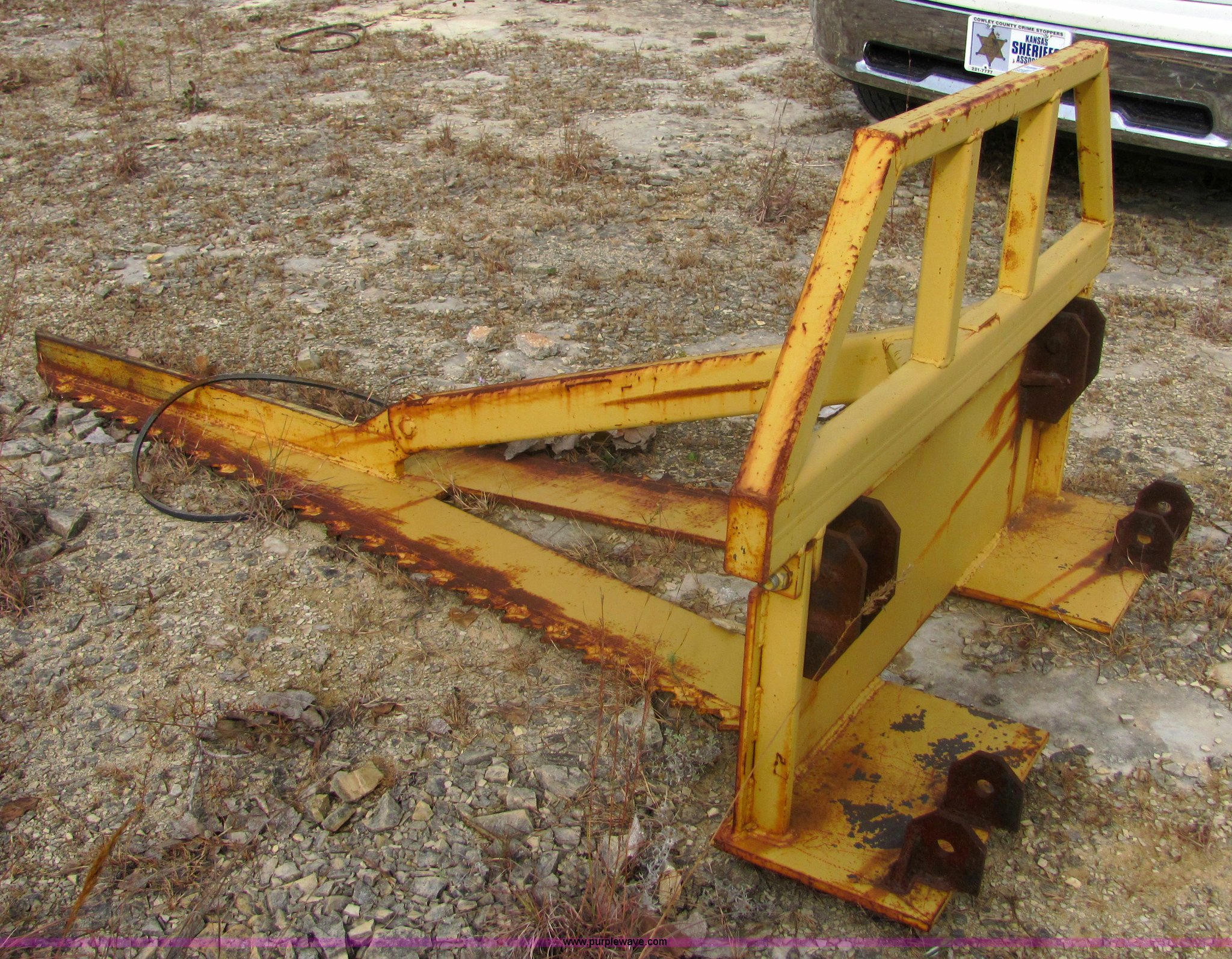 Rigid tree saw skid steer attachment in Winfield, KS Item 6656 sold Purple Wave