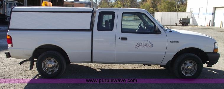 image for item 5543 1998 Ford Ranger extended cab pickup truck with topper