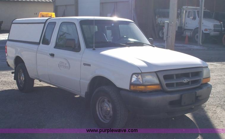 image for item 5543 1998 Ford Ranger extended cab pickup truck with topper