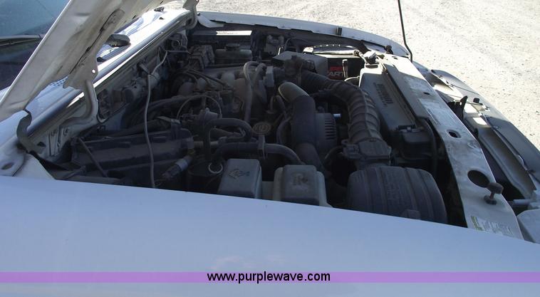 image for item 5543 1998 Ford Ranger extended cab pickup truck with topper