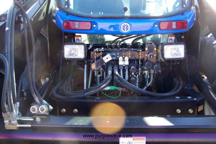 image for item 7318 2007 New Holland TV145 4WD bi-directional tractor with loader