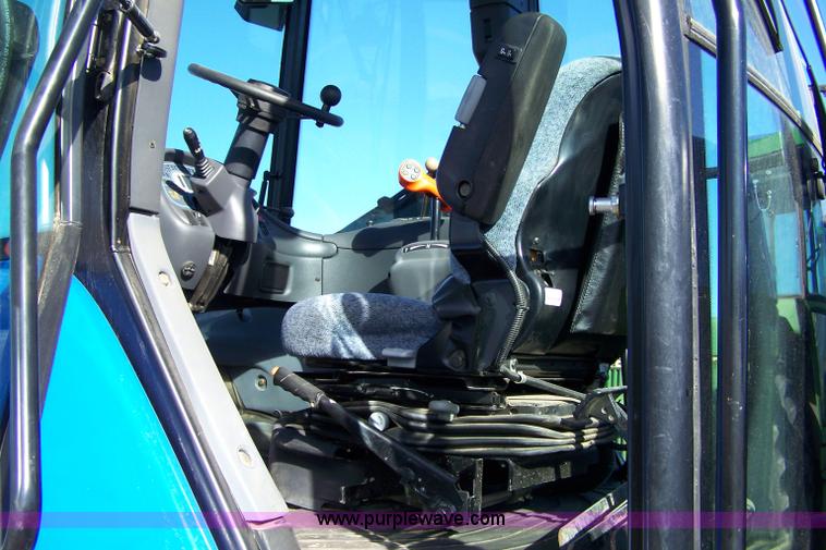 image for item 7318 2007 New Holland TV145 4WD bi-directional tractor with loader