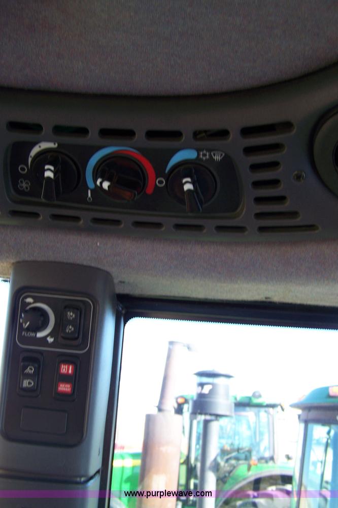 image for item 7318 2007 New Holland TV145 4WD bi-directional tractor with loader