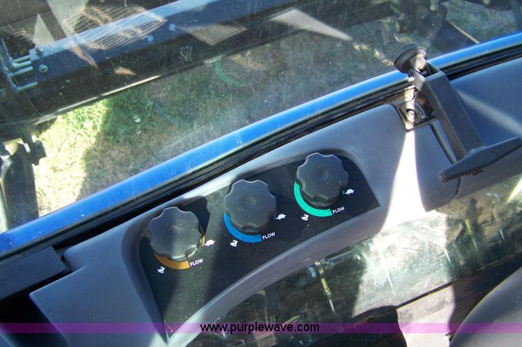 image for item 7318 2007 New Holland TV145 4WD bi-directional tractor with loader