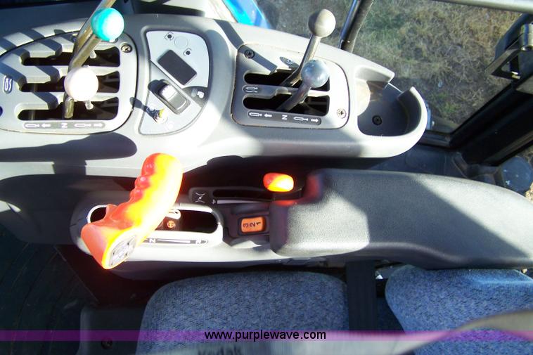 image for item 7318 2007 New Holland TV145 4WD bi-directional tractor with loader