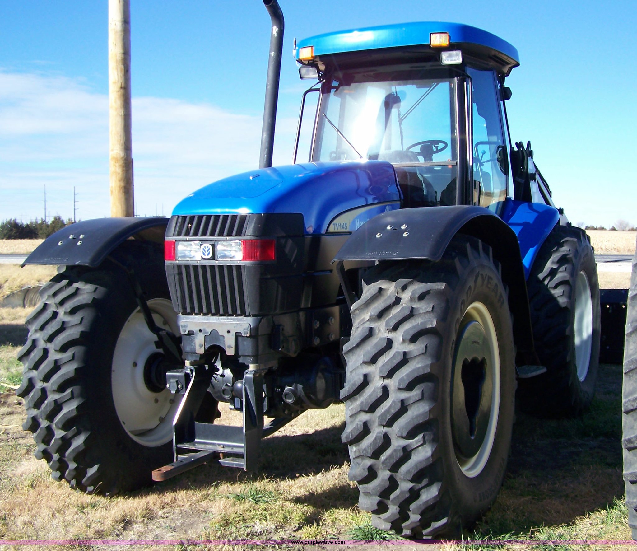 2007 New Holland TV145 4WD bidirectional tractor with loader in Hays, KS Item 7318 sold