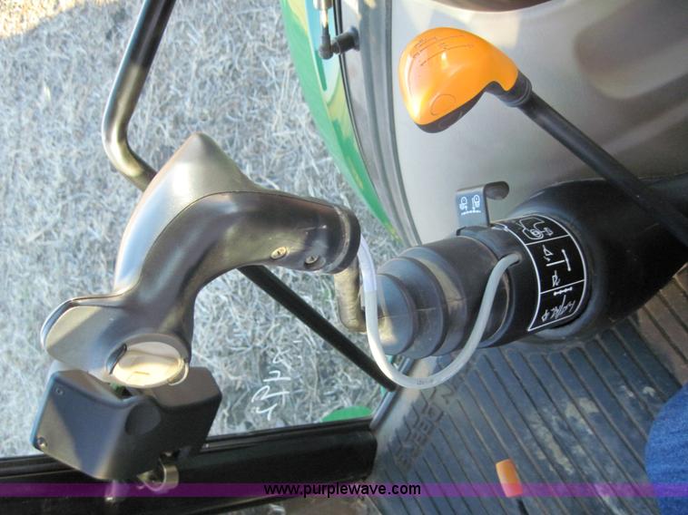 image for item 3152 2008 John Deere 5625 MFWD tractor with 542 self leveling loader