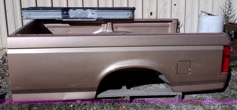 image for item 1000 1996 Ford F150 ful sized pickup bed with tailgate and step bumper