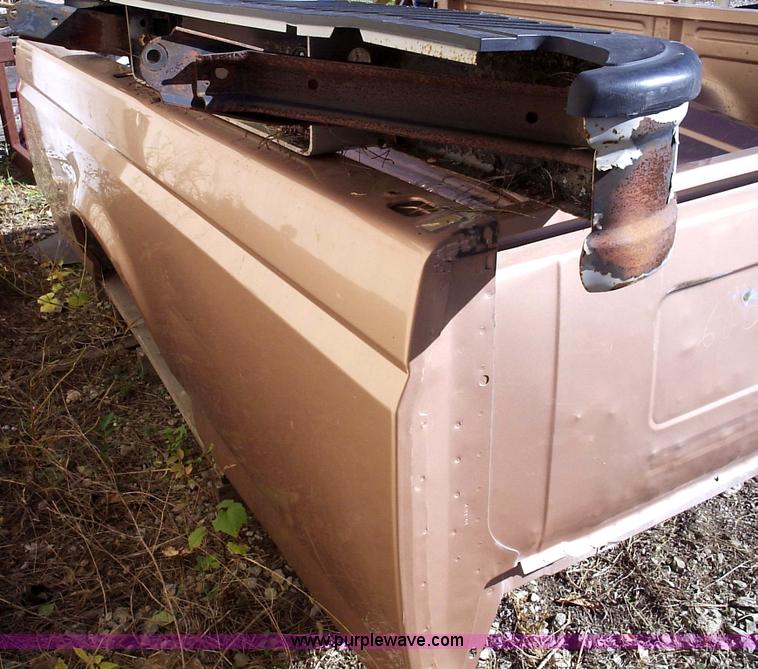 image for item 1000 1996 Ford F150 ful sized pickup bed with tailgate and step bumper