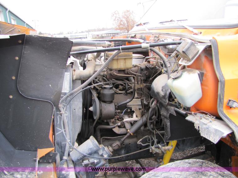 image for item 9330 1988 GMC 700 digger truck