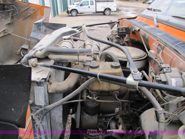 image for item 9330 1988 GMC 700 digger truck