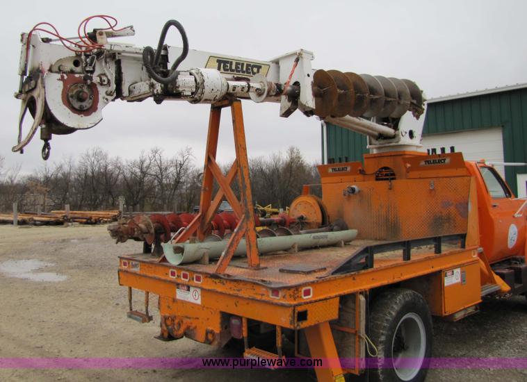 image for item 9330 1988 GMC 700 digger truck