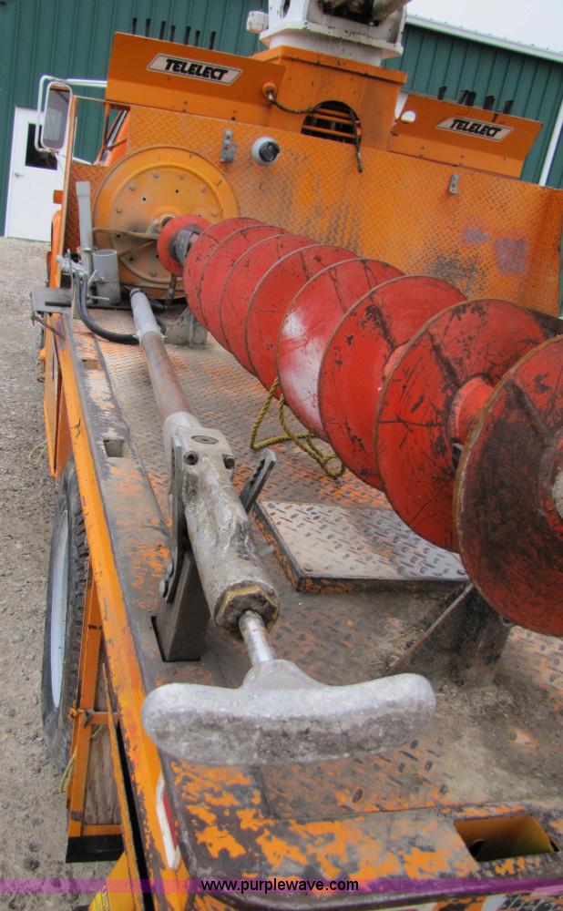 image for item 9330 1988 GMC 700 digger truck