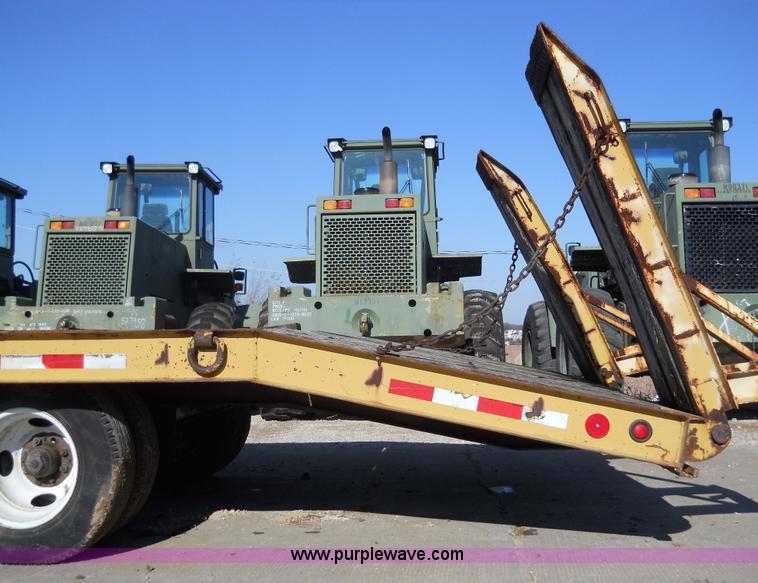 image for item 7768 1998 Dynaweld 30' flatbed trailer with dove-tail ramps