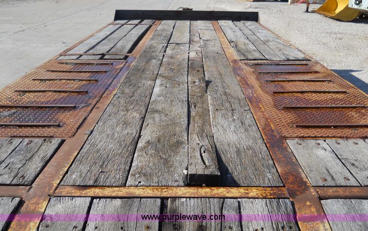 image for item 7768 1998 Dynaweld 30' flatbed trailer with dove-tail ramps