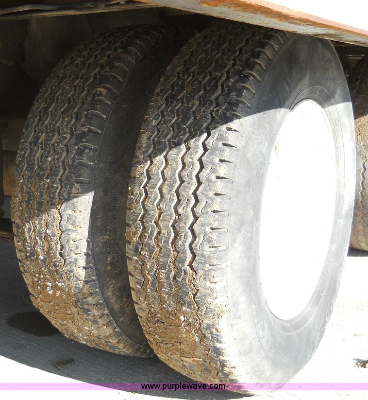 image for item 7768 1998 Dynaweld 30' flatbed trailer with dove-tail ramps