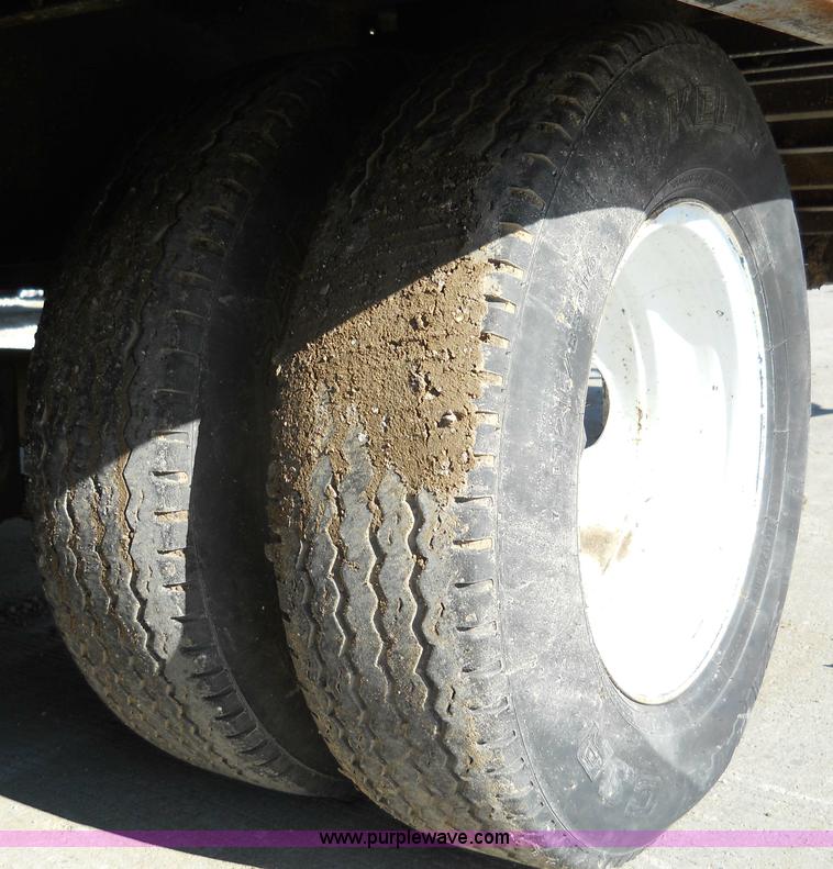 image for item 7768 1998 Dynaweld 30' flatbed trailer with dove-tail ramps