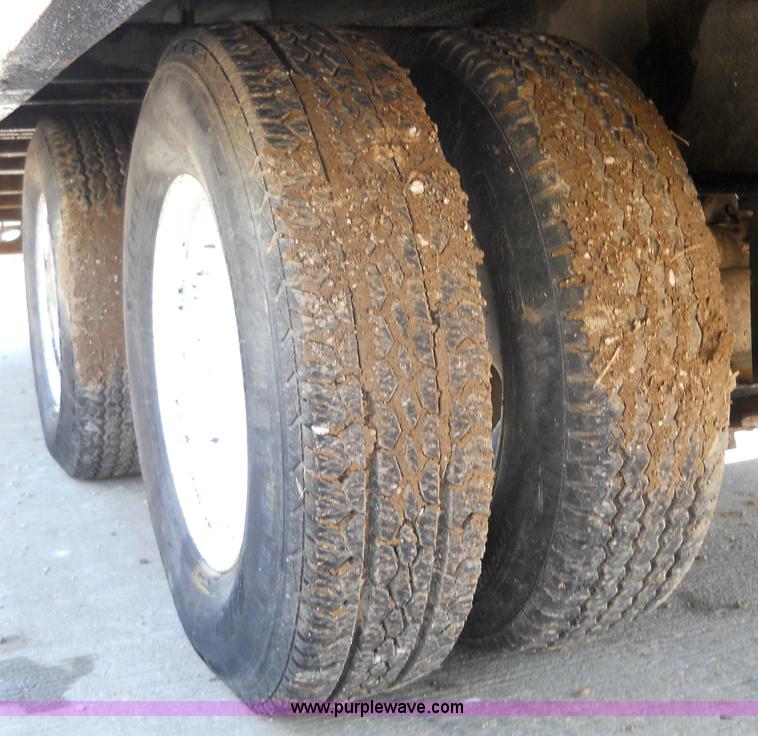 image for item 7768 1998 Dynaweld 30' flatbed trailer with dove-tail ramps